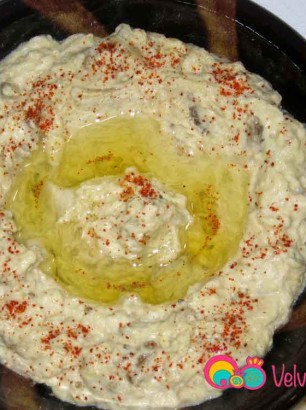 Empty into a shallow serving bowl and garnish. Serve with pita or sliced bread.