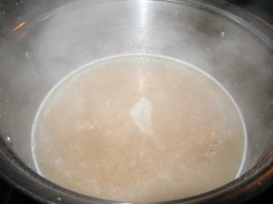Add the cream of wheat to the hot water and sugar mixture while stirring with a wire whisk. Then add the butter and cook on medium high heat until the mixture starts to boil. After a few minutes of boiling, you'll see the mixture thicken. Remove from heat and add to individual bowls. You can eat them hot, or cold, but remember to refrigerate any leftovers.
