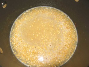 Water is added. When it starts to boil reduce heat to low and cover.