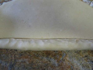 Cut the end where the dough overlaps with the bottom part.