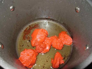 Use the pan that you sauteed the steaks to gently fry the tomato and pepper paste for a few minutes on medium heat.