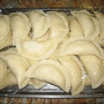 Arrange filled cheese pies between plastic Saran wraps. Cover and refrigerate or freeze.