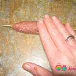 Roll the meat gently back and forth to get an even texture, and remove any bumps. It looks much neater and professional this way.
