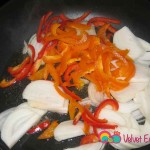 In a skillet add the onion and bell peppers.