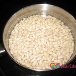Pace the beans in a saucepan and add enough water to cover the beans by about 1 inch.