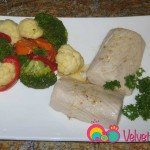 Drizzle lemon butter sauce over fish and serve with steamed vegetables.