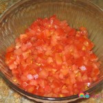 5 or 6 Roma tomatoes chopped. You can use any tomato variety.