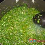 Add the chopped cilantro and parsley to the garlic.