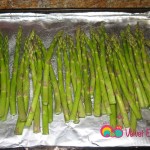 Line the asparagus spears on a foil lined baking sheet and season.
