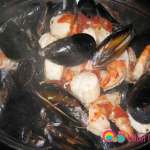 Mix the mussels, scallops, and prawns until they are cooked and the mussels have opened up.