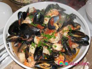 Once the mussels have opened up, empty the content into a serving platter.