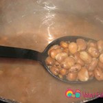 When fully cooked, the beans become soft and open up. The water becomes cloudy too.