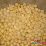 Add the garbanzo beans to another 5 quart saucepan, add water to cover by about 2 inches, and cook.