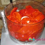 Add some of the peppers into the food processor and process till creamy.