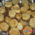 Add the sliced potatoes over the cooked beef patties.