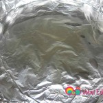 Line a large baking pan with foil to cover the pan completely. Add the vegetable oil.