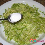 Add 1/2 teaspoon salt to the grated zucchini and leave to rest.