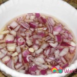 Add the vinegar to the onions.