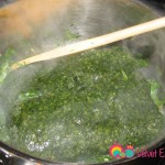 Add the mloukhiyeh to the cilantro garlic mixture.
