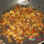 Saute the onions in a small skillet with the vegetable oil.