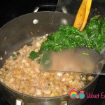 Add the spinach to the onions.