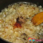 Add the seasonings to the onions in the skillet and continue to cook till they turn brown in color.