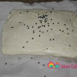 Sprinkle one side with black caraway seeds.