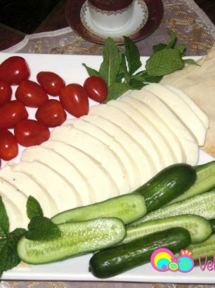 Halloumi cheese served with cucumbers, tomatoes, mint and pita bread.