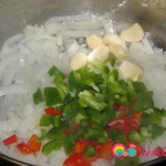 Add the diced green / red peppers and garlic to the pan with the onions.