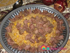 Place the bulgur pilaf and arrange the beef chunks over the top.