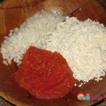 In a bowl combine the pepper paste, tomato paste, grated cheese and diced onions.