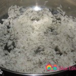 In a 7 quart saucepan add the vegetable oil. Add a layer of rice enough to coat the bottom of the pan.