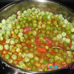 Add the frozen peas to the tomato sauce.