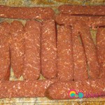 Slice each soujouk sausage into 4 thin slices.