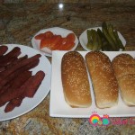 Prepare the sandwich buns, the soujouk, sliced pickles and tomatoes.