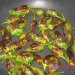 Continue to fry till peppers are soft and blistered form all over.