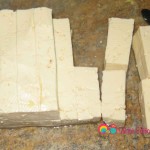 Cut the tofu horizontally, then crosswise in half and finally into strips.
