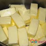 Empty the butter packets into a large pot.