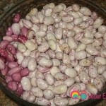 Shell the beans, place them in a bowl and set aside.