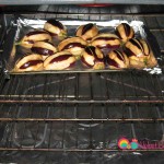 Drizzle some more oil over the top to coat the eggplants completely. Broil but place the sheet in the center of the oven.