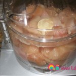 Add the cut pieces of chicken into a food processor. Work in batches.