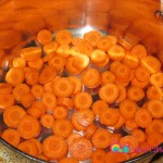 Cut the carrots in round shape, and add to pot.