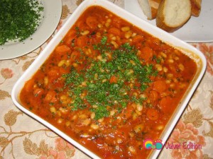 Classic Armenian plaki salad, drizzled with olive oil and garnished with parsley.