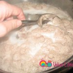 As the beef cooks the water will froth. Remove the froth from the surface using a large spoon.