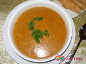 Pour into individual bowls and garnish with parsley. Serve.