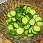 Slice the cucumbers into 1/4 inch slices.