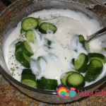 Add the cucumbers to the yogurt.