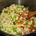 Add the vegetables to the tomato paste mixture.