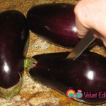 Cut about 6 random slits into each eggplant.