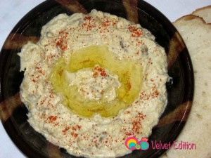 Empty into a shallow serving bowl and garnish. Serve with pita or sliced bread.
